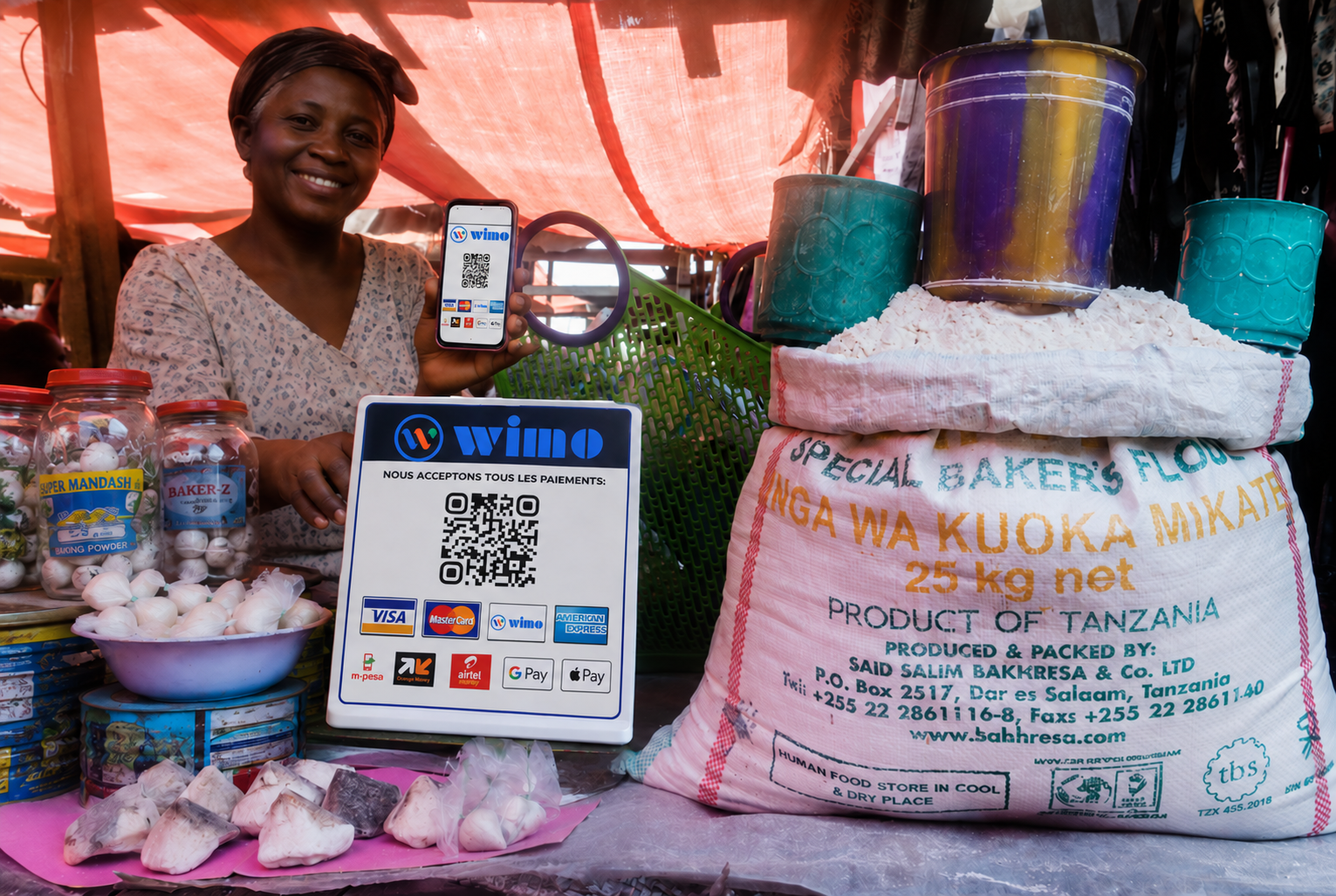 African merchant presenting a Wimo CashPoint QR